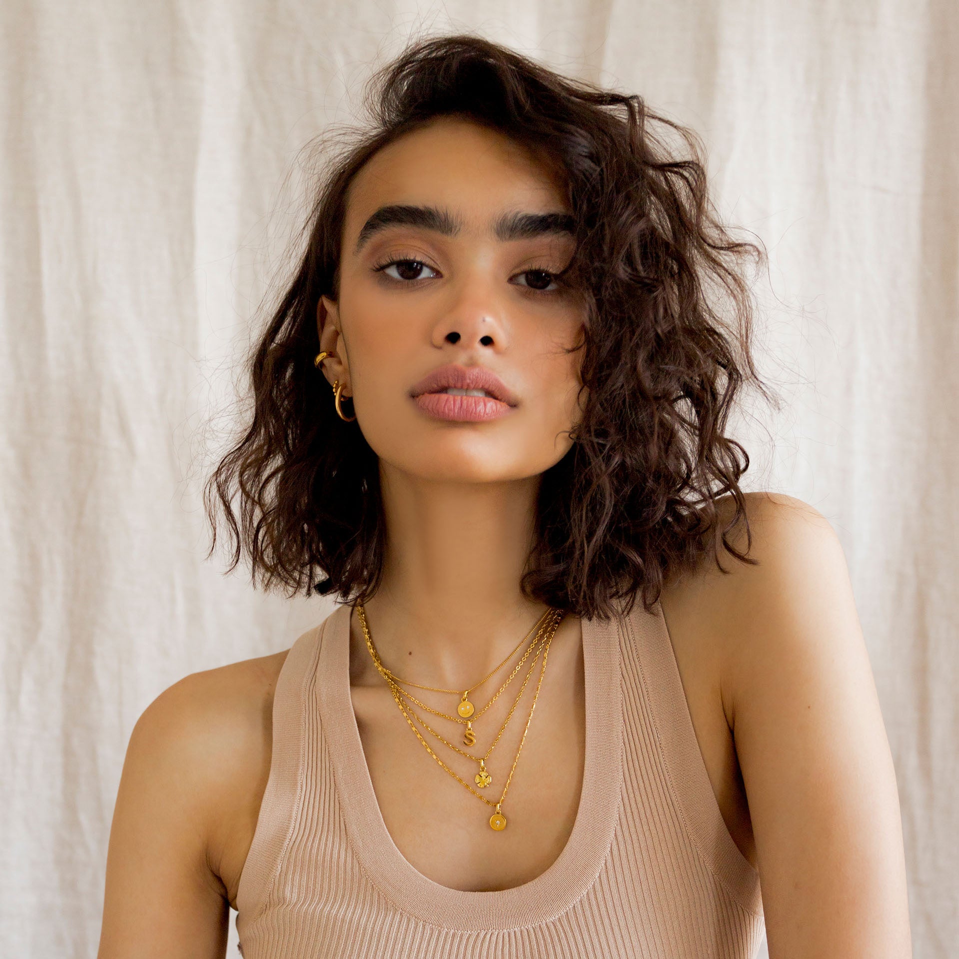 Model wearing Customize Me necklaces