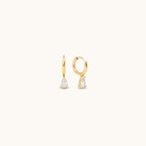 Small, "huggie" hoop style earrings with a drop cubic zirconia stone. 