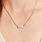 Engravable necklace with "amour" written on a silver bar with a box chain
