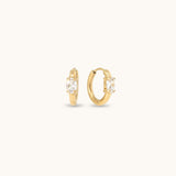 Gold hoop earrings with cubic zirconia stones.